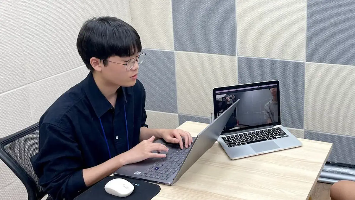 A teaching assistant on a call with a student
